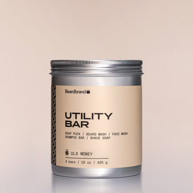 A container of Old Money Utility Bars against a neutral background.