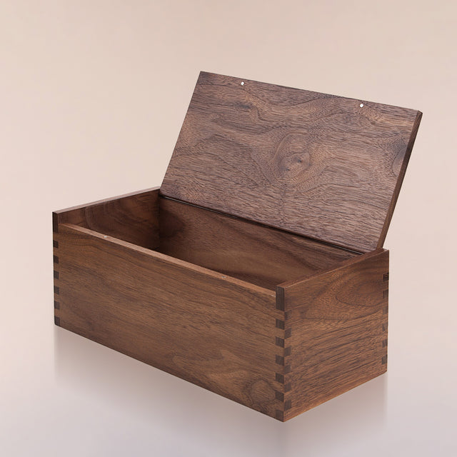 The black walnut Beardbrand Beardsman’s Box shown from the side with the lid opened.