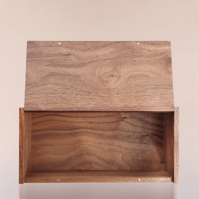 The black walnut Beardbrand Beardsman’s Box shown from the top with the lid opened.