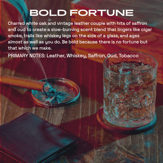 Fragrance graphic titled ‘Bold Fortune’ over a wooden tabletop with a crystal glass of whiskey and leather wallet, describing a charred white oak and vintage leather scent with saffron, oud and tobacco notes.