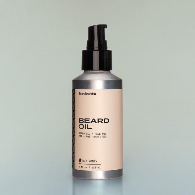 A bottle of Old Money full-size Beard Oil with a pump dispenser against a grey background.