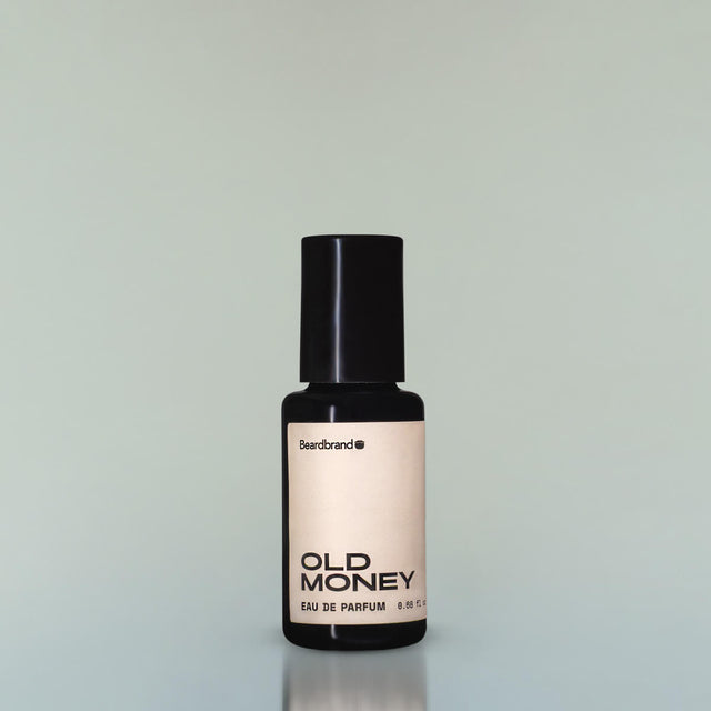 A bottle of Old Money Eau de Parfum against a grey background.