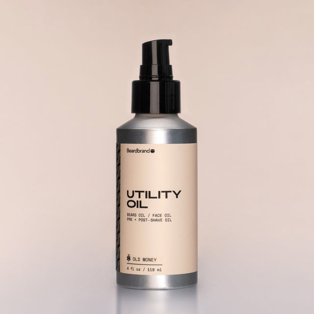 A bottle of Utility Oil with a pump dispenser against a neutral background.