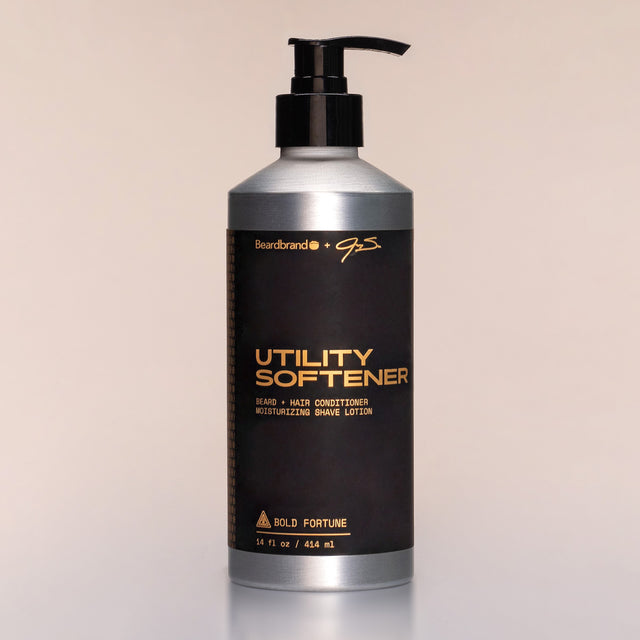 A bottle of Bold Fortune Utility Softener with a pump dispenser against a neutral background.