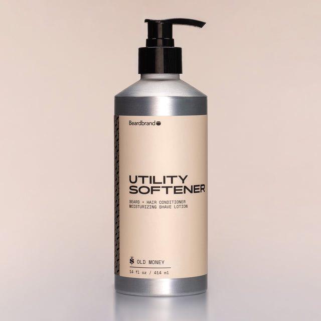 A bottle of Utility Softener with a pump dispenser against a neutral background.