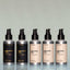 Five bottles of full-size Beard Oil (Bold Fortune, Norse Winter, Old Money, Tree Ranger and Temple Smoke) side by side against a grey background.