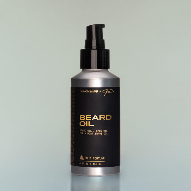 A bottle of Bold Fortune full-size Beard Oil with a pump dispenser against a grey background.