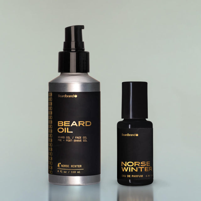 A bottle of Norse Winter Beard Oil and Bold Fortune Eau de Parfum against a grey background.
