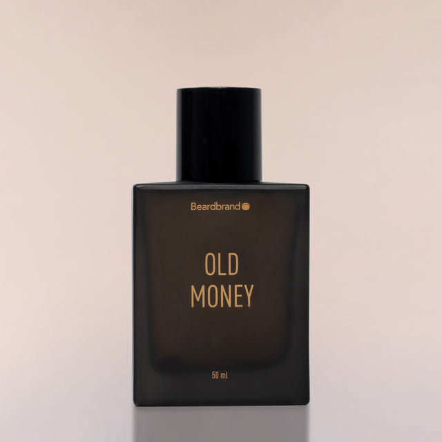 An square bottle of Beardbrand Old Money Eau de Parfum against a neutral background.