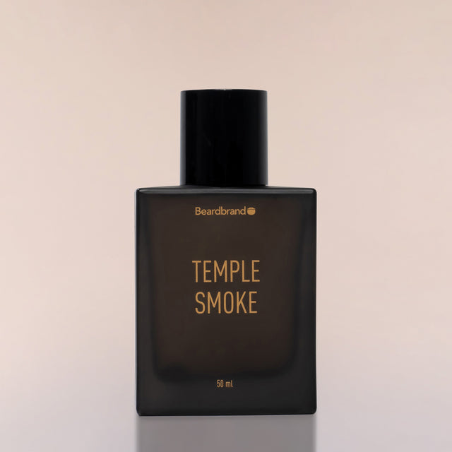 An square bottle of Beardbrand Temple Smoke Eau de Parfum against a neutral background.