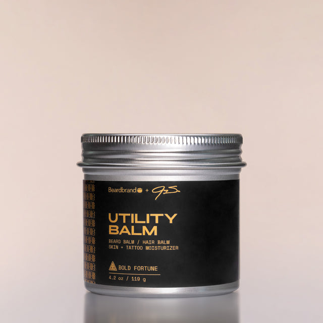 A container of Bold Fortune Utility Balm against a neutral background.