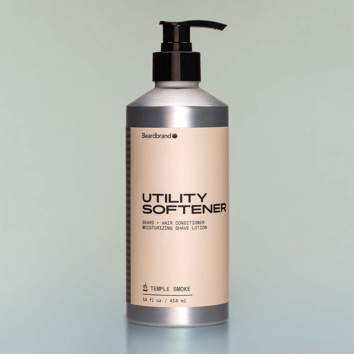 A bottle of Temple Smoke Utility Softener with a pump dispenser against a grey background.