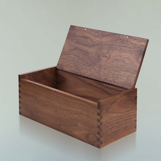 The black walnut Beardbrand Beardsman’s Box shown from a side angle with the lid opened.