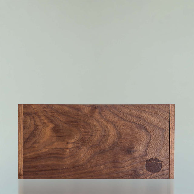 The black walnut Beardbrand Beardsman’s Box shown from the top with the lid closed.