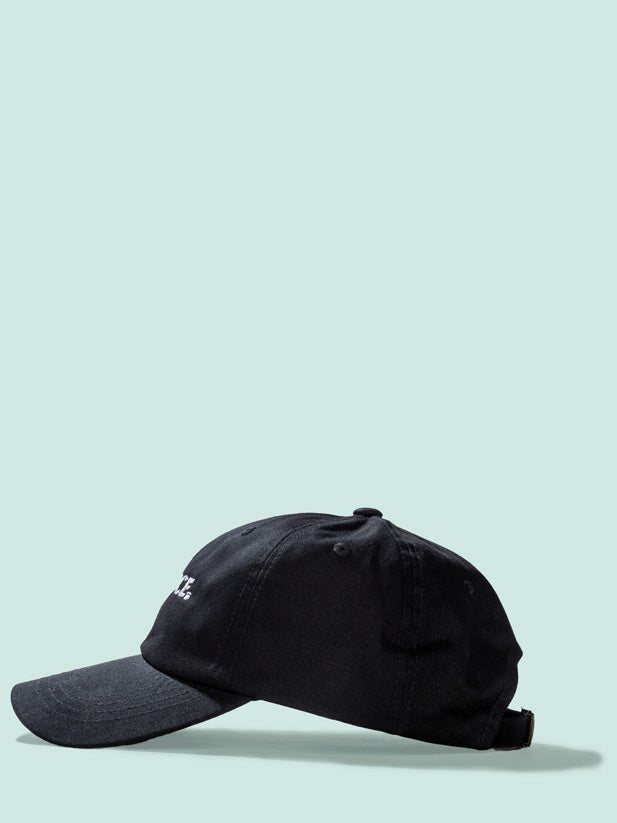 The Alliance Dad Hat in black 100% cotton twill with the logo embroidered in white—side view.